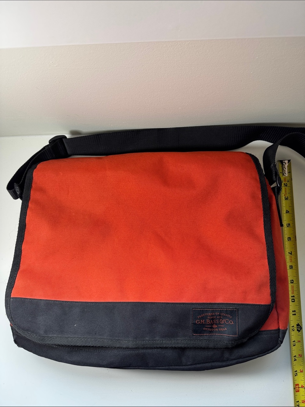 GH Bass Orange and black messenger bag.